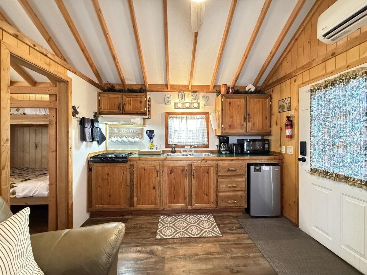 This cozy kitchen has the necessities needed for making a small meal or brewing up a cup of coffee.