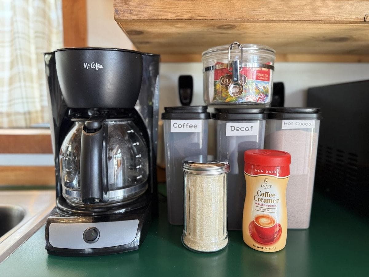 This cozy kitchen has the necessities needed for making a small meal or brewing up a cup of coffee.