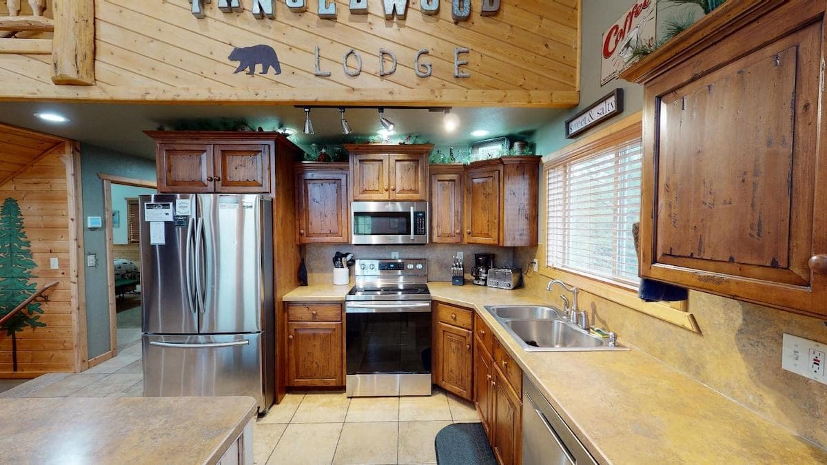 Full kitchen with appliances, cookware, dishes, silverware, and basic spices.