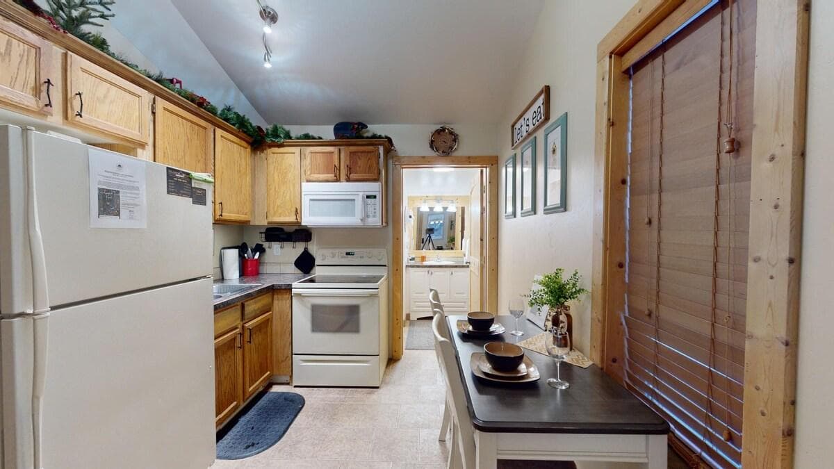 When you enter you are greeted by the kitchen and dining area.
