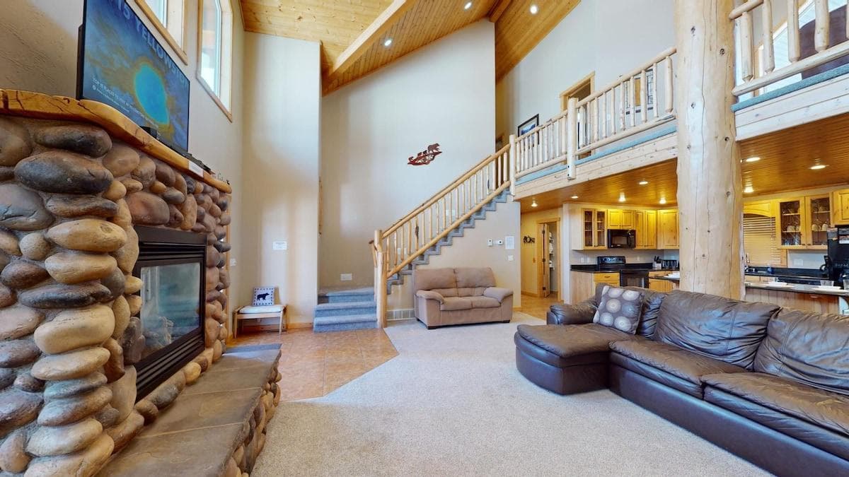 Natural light pours in through large windows, tying it all together with a view of the forest just beyond.